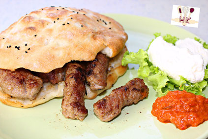 Homemade Bosnian kebabs with kajmak